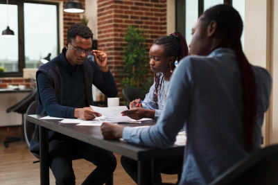 Project managers sitting at table