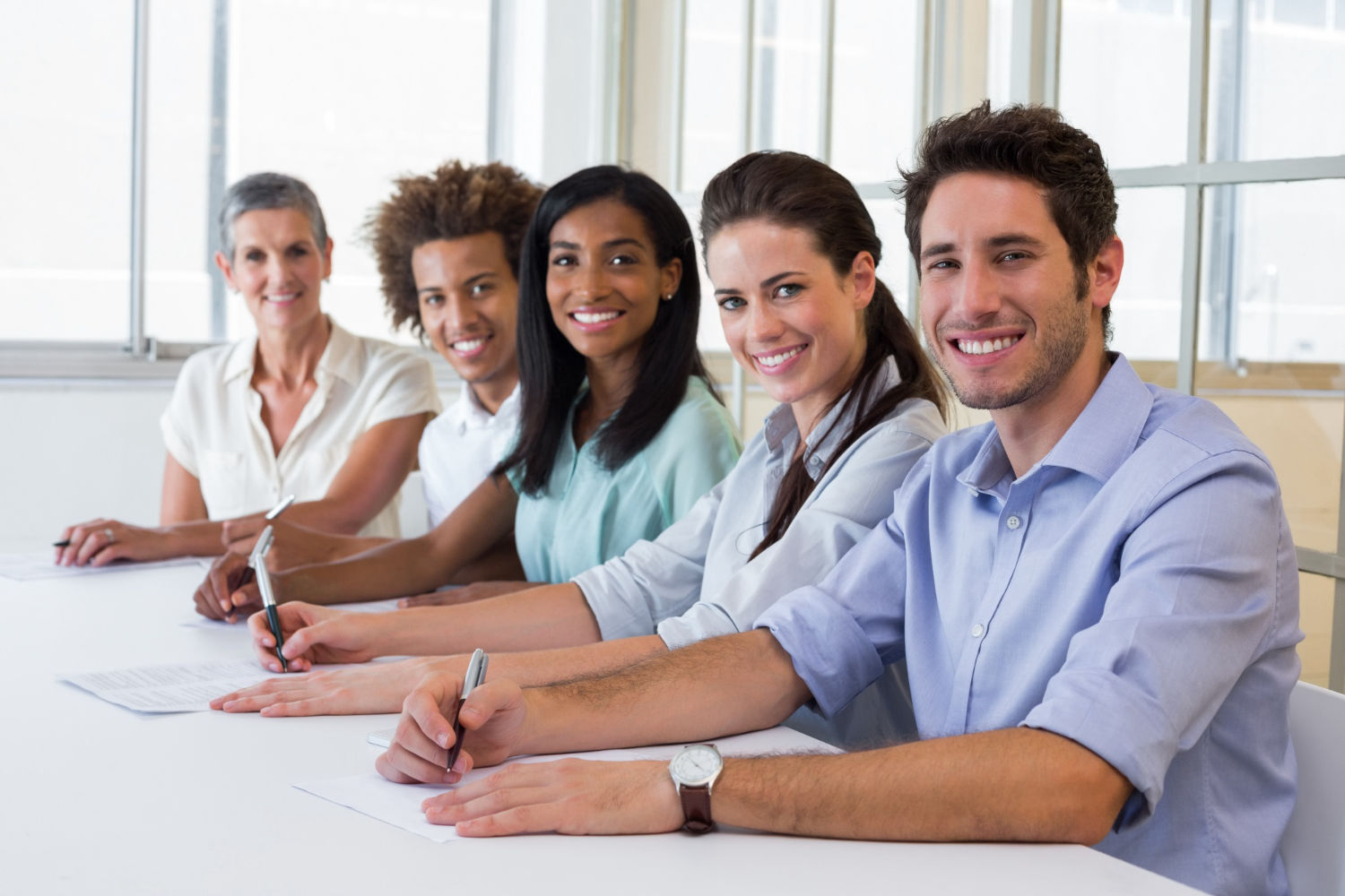 Group of workers looking at camera