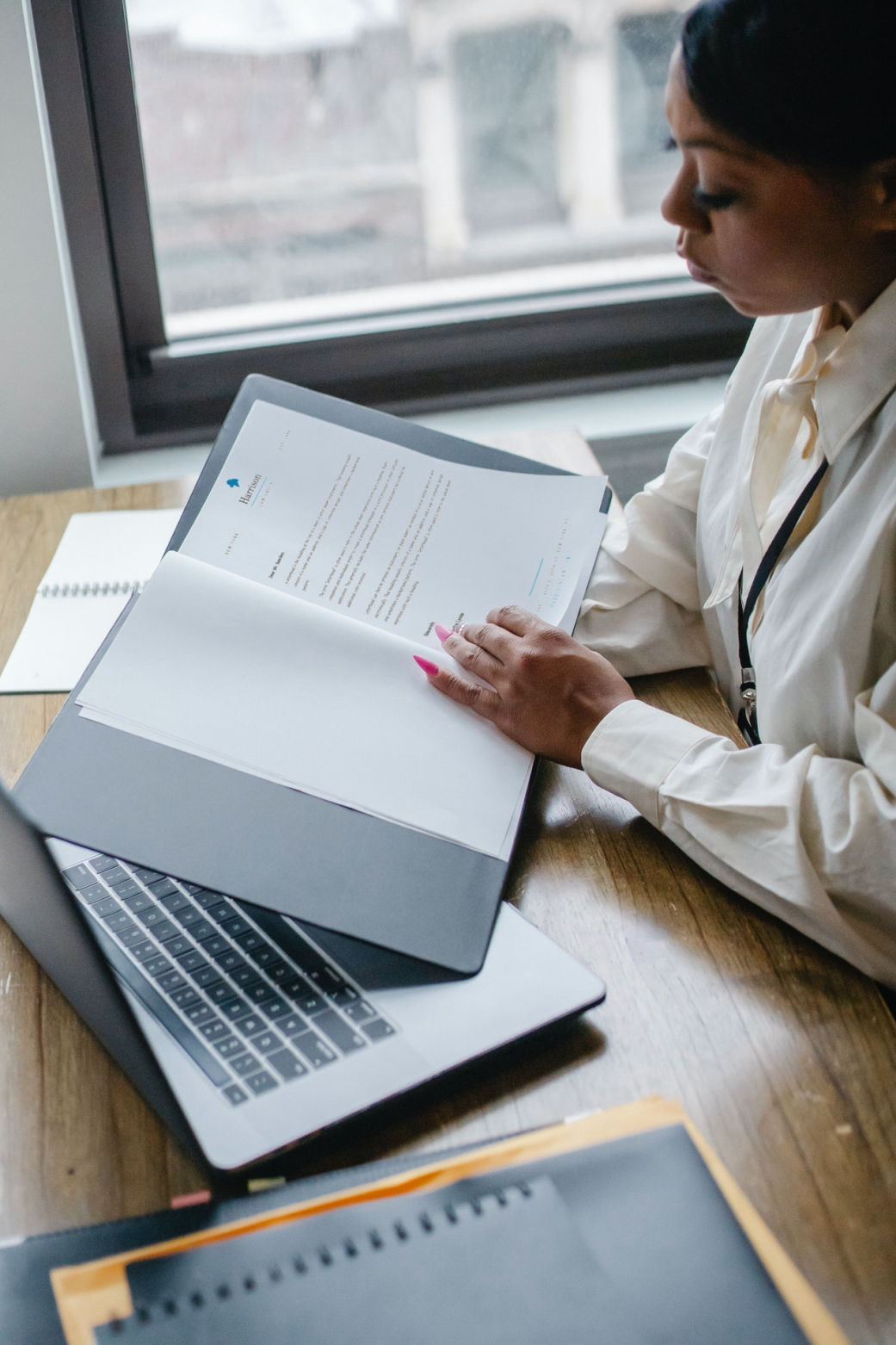 Woman looking at documentation